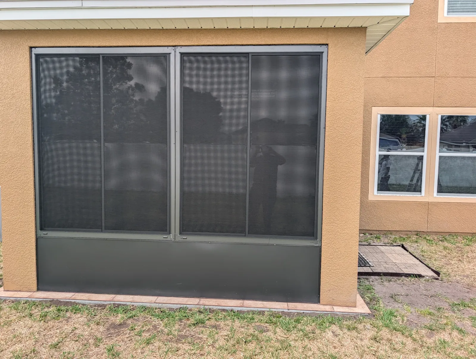 Completed screen enclosure on a Greater Jacksonville, FL home — the kind of job a written quote should spell out