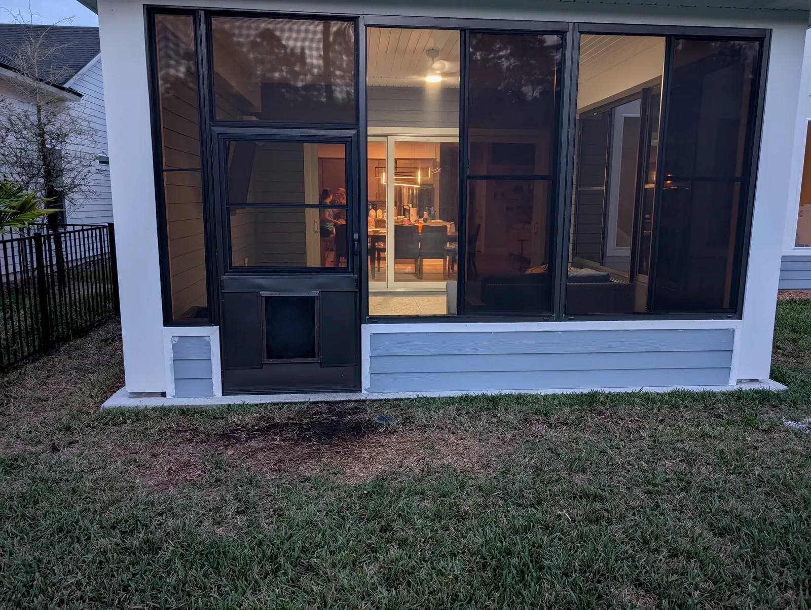 Screen walls added under an existing patio cover in Jacksonville, FL